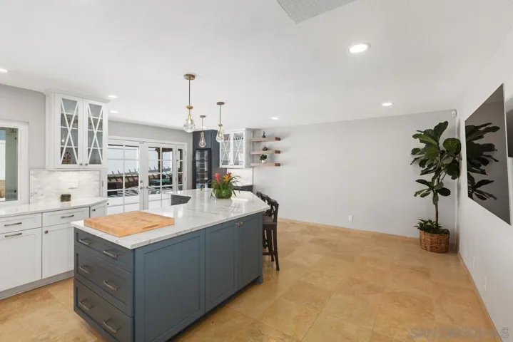 Room in the kitchen area for a breakfast nook or additional kitchen table.