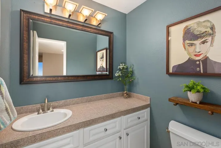 Guest half bath located on first level with privacy.