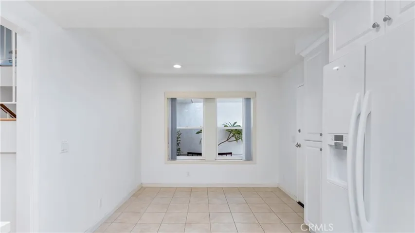 Large kitchen--add a breakfast table or more cabinets. Direct access to the garage.