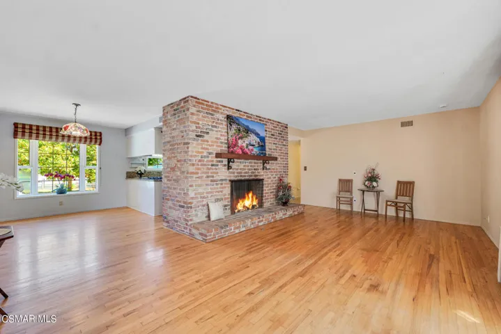Brick Floor To Ceiling Fireplace