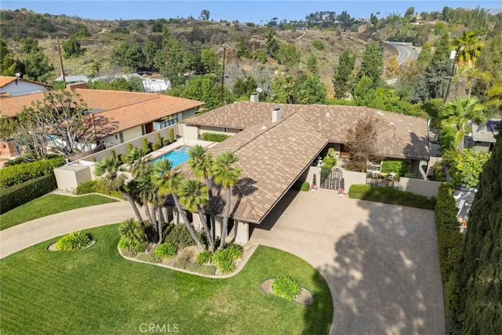 This is the first time in almost 50 years that this home is being offered for sale. Like the previous owners, you can make this your "forever home".  It is a single level home on a cul-de-sac street. The front yard is large enough for a circular driveway and porte cochere. There is another long driveway that leads to the attached 2 car garage.