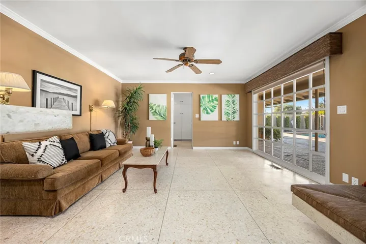 Living a well-lived life begins at home. This family room is conducive to lingering and lounging. What better setting than a home that inspires gathering and catching up after a full day?