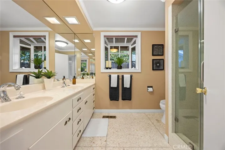 Hall bathroom is located between Bedroom #2 and Bedroom #3. It is a large bath with dual sink vanities and a shower.