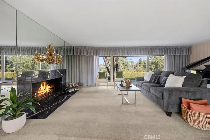 Once inside the home, your guests will be impressed with the spacious formal living room. The living room carves out a spot for elegant and refined entertaining.