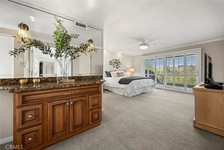 Built in dresser in primary en suite creates a streamlined and uncluttered look while maximizing floor space.