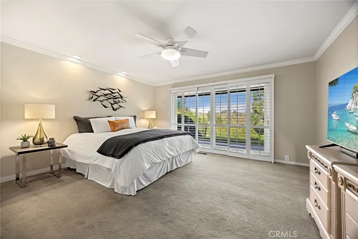 Primary bedroom is a luxurious retreat and will be your sanctuary. This sanctuary is a very private and quiet as there are no neighbors behind this home. A wall of windows bring in serene tree top views of Coyote Hills. Wood shutters allow you to determine how much or how little light you want in your room. Primary suite has 3 spacious closets and an updated en suite bathroom.