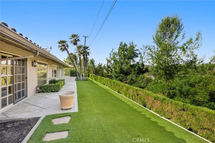 The backyard has eco-friendly turf which makes it low maintenance.