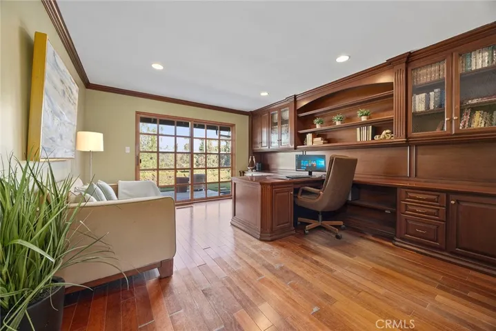 Bedroom #4 is currently used as an office. Home office has built in bookshelves and desk providing professional environment for working remotely.  French doors with beveled glass opens up for fresh air and open views of Coyote Hills.