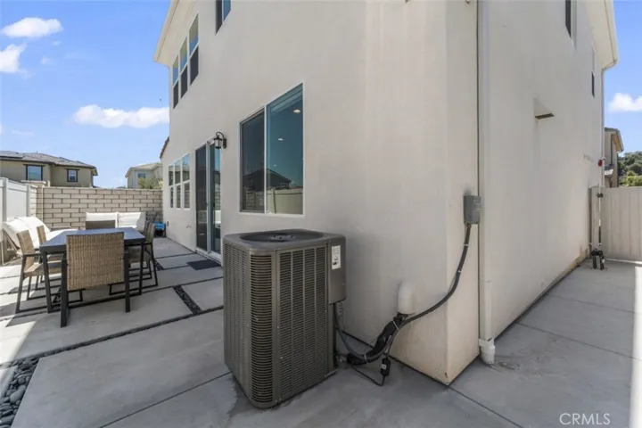 DUAL LEVEL AC. 
FEATURES UPGRADED RAIN GUTTERS TO FULL WRAP GUTTERS WITH DOWNSPOUTS.