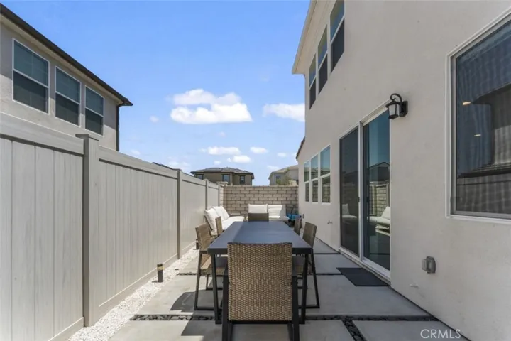 WELL-DESIGNED ENTERTAINER'S PATIO WITH UPGRADED UPGRADED CONCRETE TRAVEL PATH.