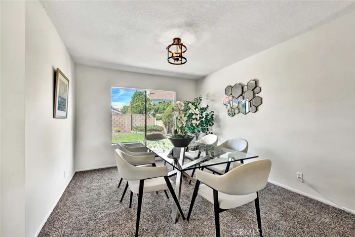 Designer Details, INcluding Contemporary lighting elements make this large formal dining space a special place to entertain family and friends.