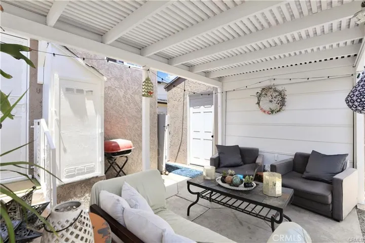 Carport next to front house. The front unit has a detached single-car garage.