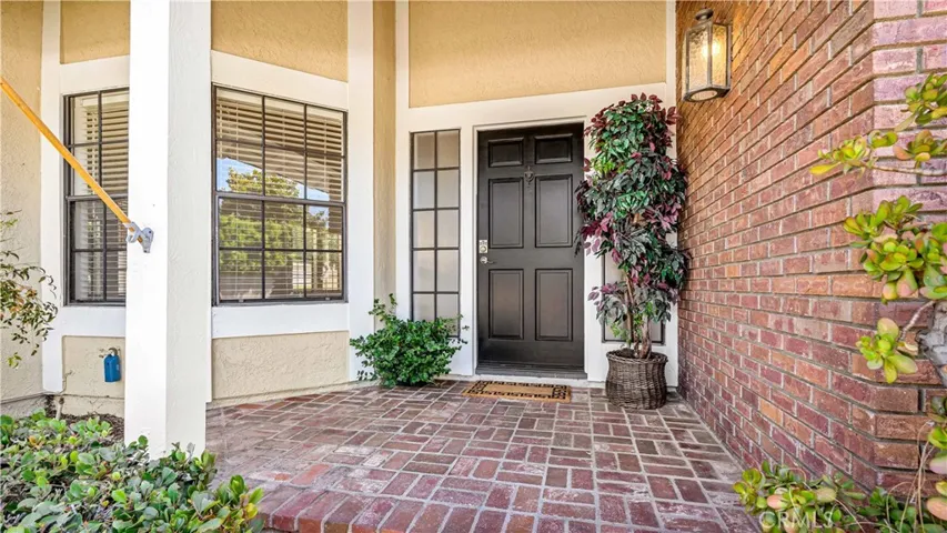 Love the black front door and brick landing