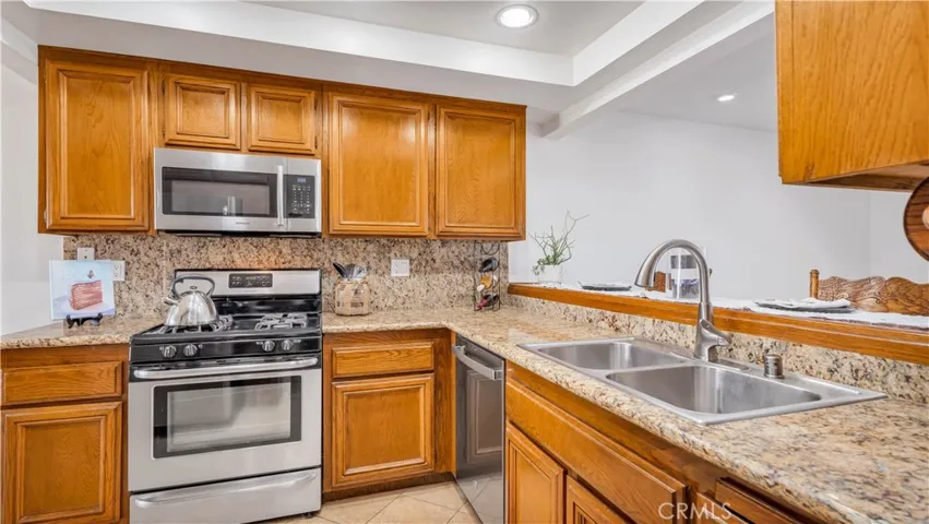 Granite counters and stainless steel appliances: GAS Range, Space saver microwave, dishwasher and refrigerator