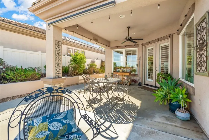 Covered Patio with Roll-up Sun Shade and Ceiling Fan