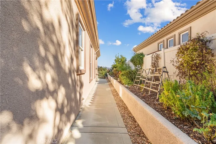 Beautifully Landscaped Planter runs along entire side of house