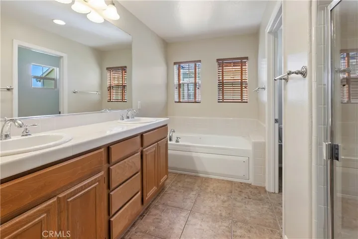 Master suite with double sinks, separate tub & shower.
