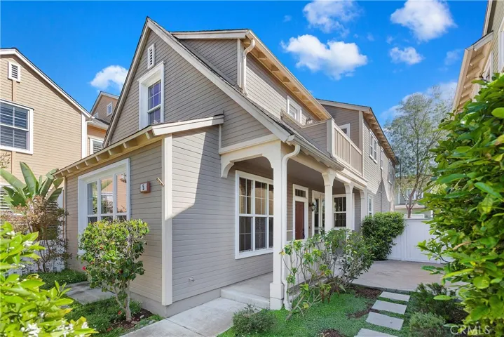 Front view of home with large front community lawn area for kids to play.