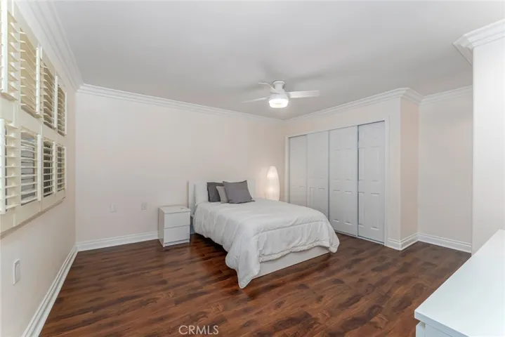 Primary bedrrom with paneled closet doors
