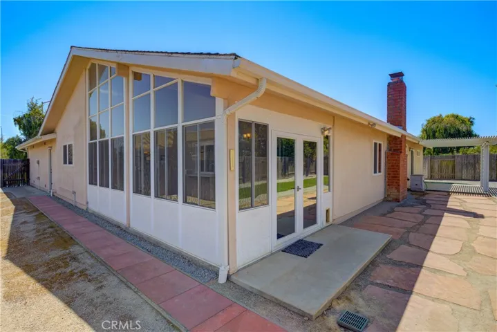 Enclosed Patio Room with floor to ceiling glass windows.