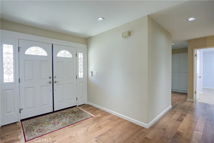 Foyer with engineered hard-wood flooring