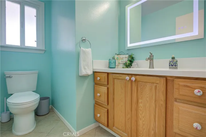 Half-bath with newer vanity