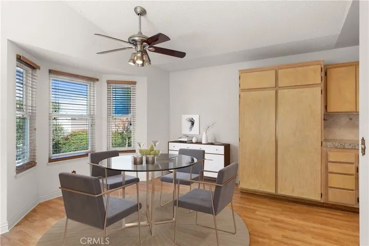 Dining area with pantry storage.  Virtually Staged.