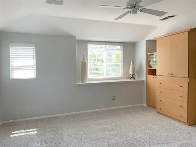 Spacious primary suite with plenty of natural sunlight