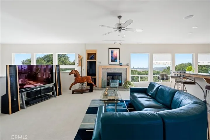 Third floor family room with cozy fire place