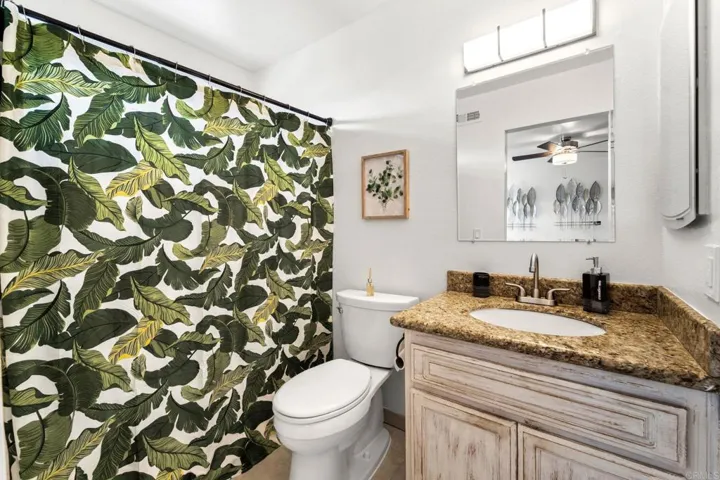 En-suite bath with tub & shower.