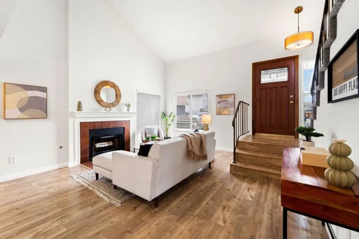 A cozy living room with fireplace is the epitome of comfort and warmth greating you upon entry.