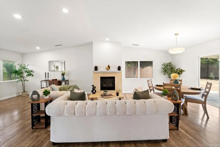 A great room w/ a fireplace and vaulted ceilings can strike the perfect balance for cozy gatherings.