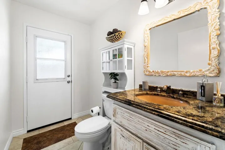 Downstairs 1/2 bath opens to pool for convenience.
