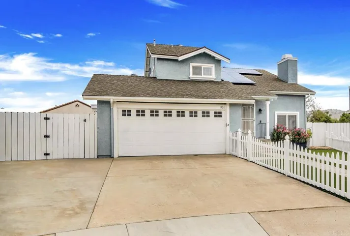 A spacious driveway with room for multiple vehicles & RV parking.