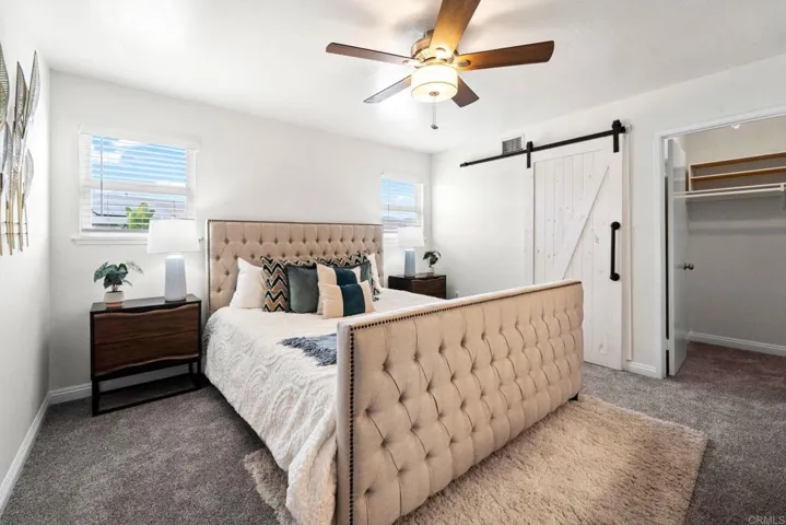 Primary bedroom offers custom built-ins & en-suite bathroom.