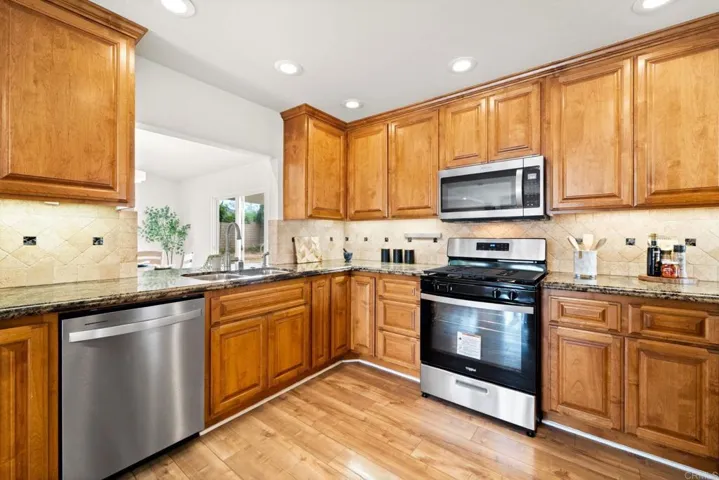 An open kitchen with two pass-throughs makes it easy to entertain, cook, and socialize.