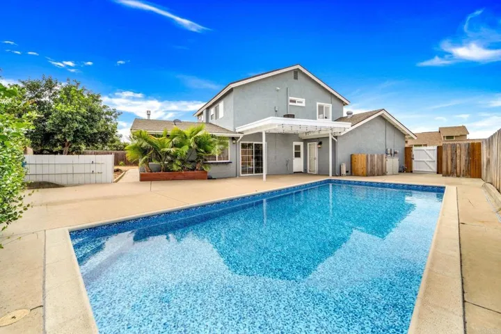 A beautiful pool glistening in the sunlight, with crystal clear water invites you to take a dip.