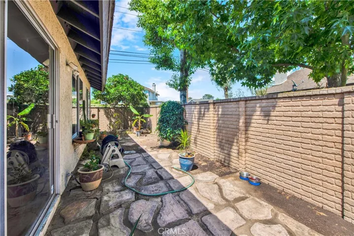 Wrap-Around Patio with Access Out to Lush Greenbelt