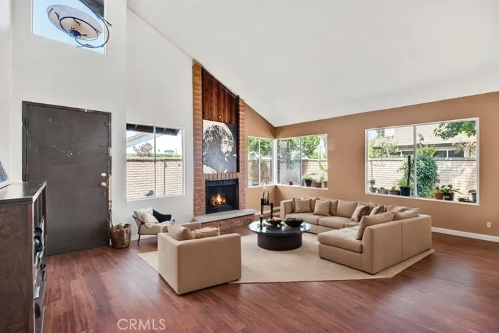 Virtual Staging in this very Spacious Living Room with soaring Vaulted Ceiling