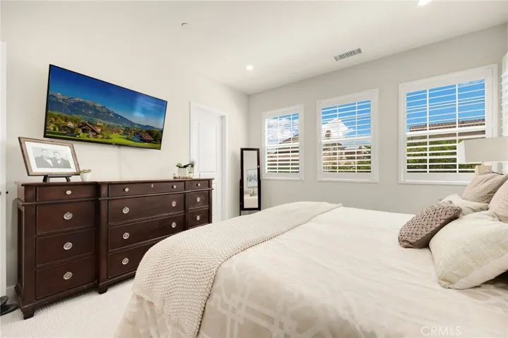 Walk in closet with tons of storage.