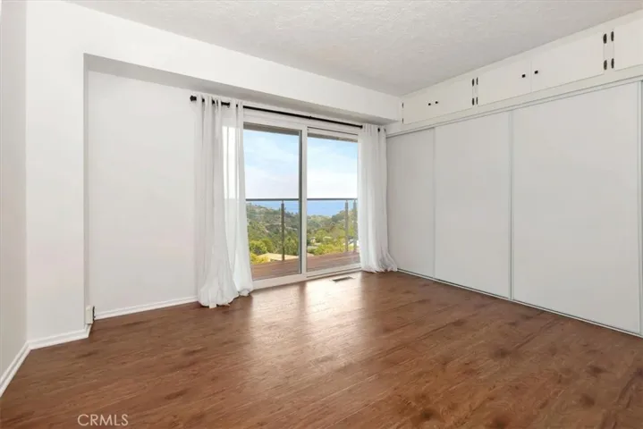 Downstairs guest bedroom with ocean views and access to the terrace