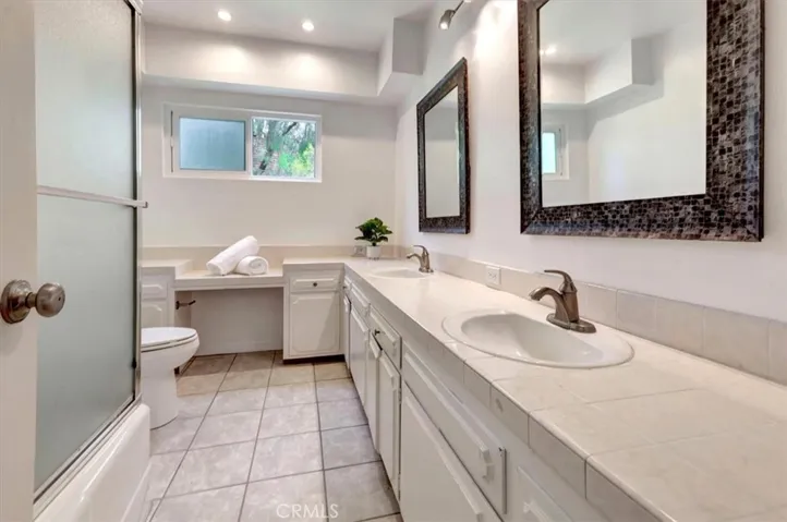 Downstairs bathroom with dual sinks