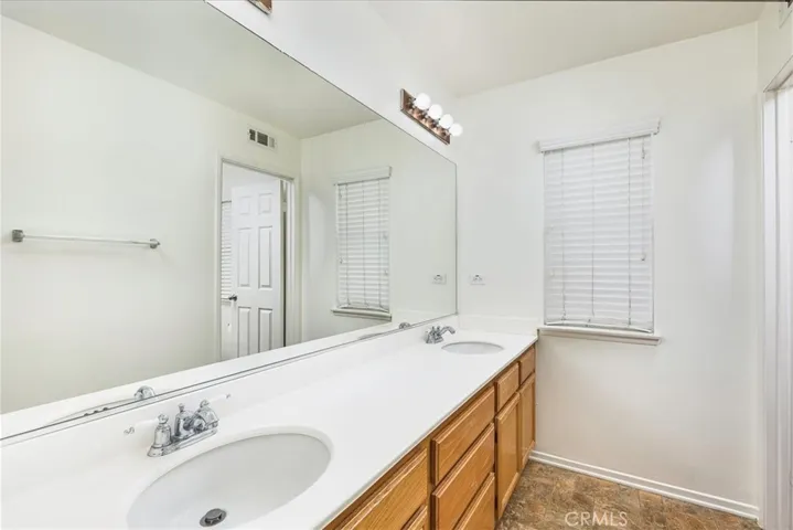 Upstairs bathroom to the right is a separate w commode, shower and tub