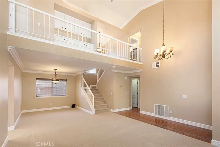 View toward dining room and stairwell to the second level