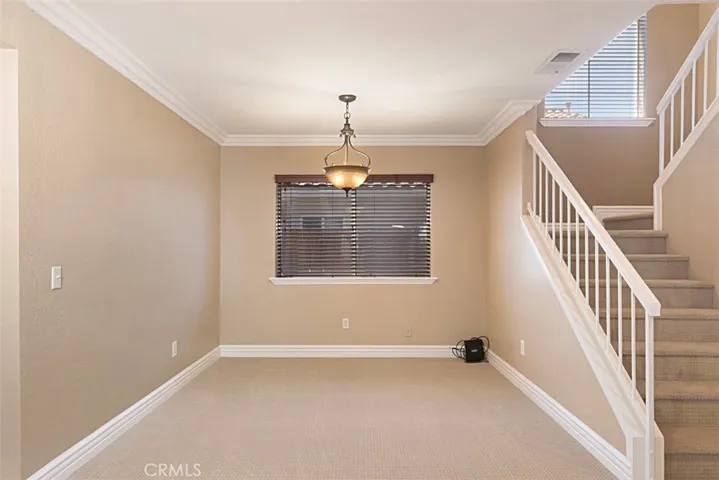Dining room and stairwell to the right