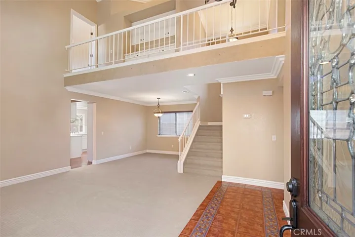Living room, dining room and open landing upstairs seen upon entry