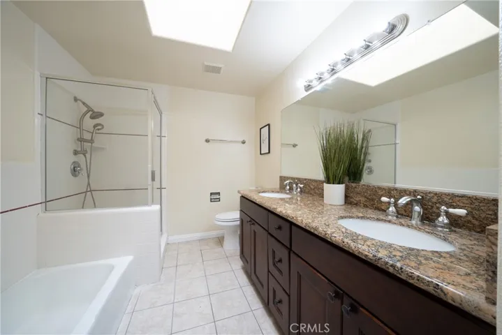 Primary Ensuite with dual sink, skylight, separate tub and shower.