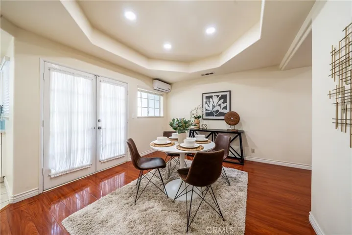 Dining area leads to the main floor balcony. AC wall unit is strong and cools the entire main floor in just minutes.