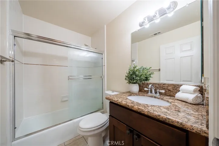 Hallway shared full bathroom.