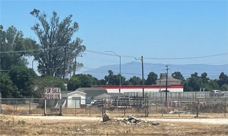 ForSale sign visible 215 Frwy overpass/onramp